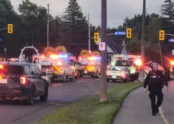 Emergency crews respond to Friday morning's single-vehicle crash at the corner of Riverside Drive and Walkley Road. Thanks to the quick efforts of several bystanders