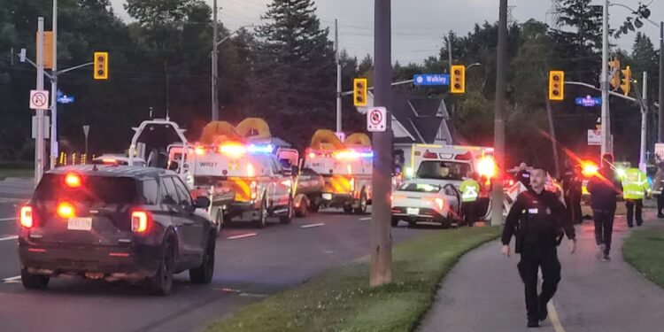 Emergency crews respond to Friday morning's single-vehicle crash at the corner of Riverside Drive and Walkley Road. Thanks to the quick efforts of several bystanders