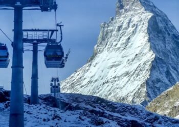 Gondolas go up next to the Matterhorn in Zermatt, Switzerland,