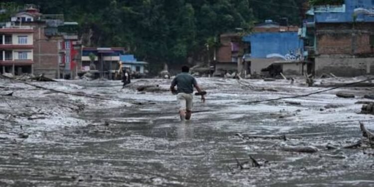Two days after watching scenes of a devastating flash flood that shook the world, Darren Tosh was on a plane to the disaster zone in Nepal.