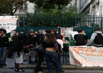 Students protest outside a school in France
