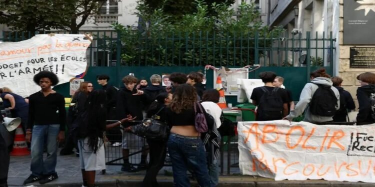 Students protest outside a school in France